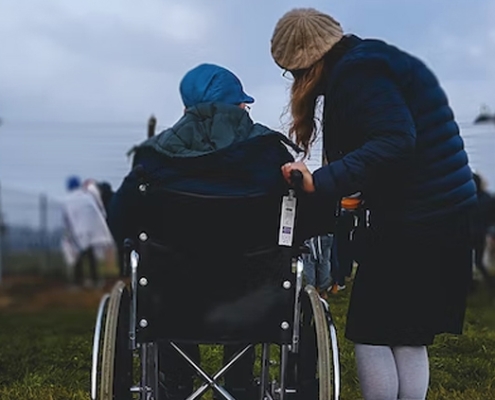 Woman in a wheelchair with caregiver – disability insurance coverage Canada