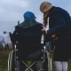 Woman in a wheelchair with caregiver – disability insurance coverage Canada