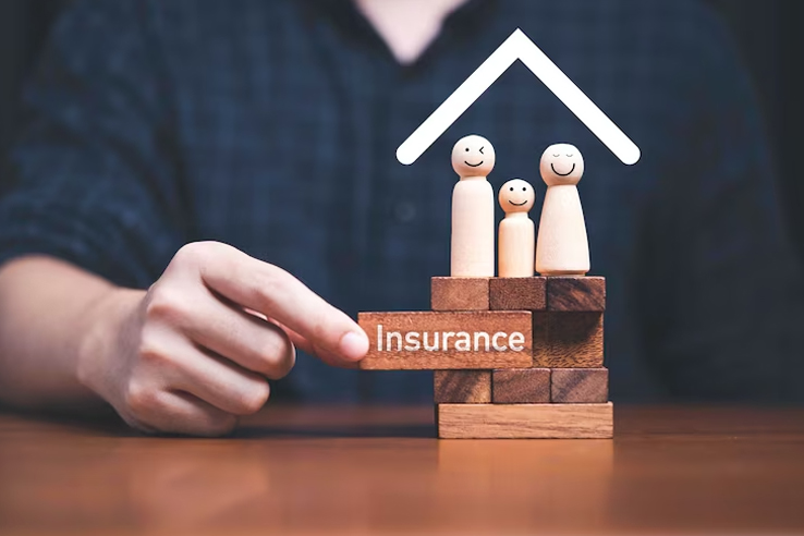 Family figures under a protective roof built on insurance blocks – Get Me Insurance