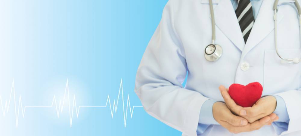 Doctor holding a heart, symbolizing critical illness insurance coverage